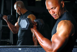 man doing dumbbell curls