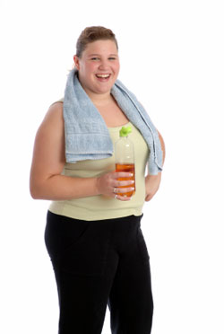 smiling woman drinking beverage