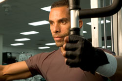 man doing flyes on an exercise machine