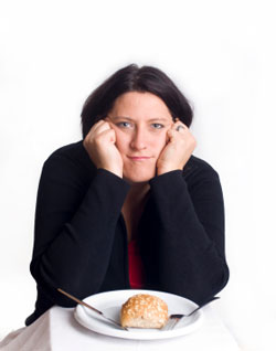 woman leaning on her hands frustrated about her weight 