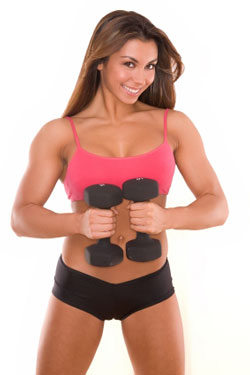 woman in red top and black shorts holding dumbbells