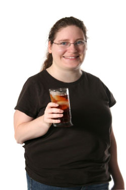 overweight woman drinking diet soda