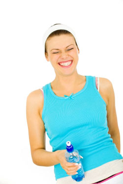 very happy woman with a water bottle